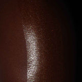 a photo showing the results of the attention seeker shimmer oil on black skin. the best shimmer oil for bronzing, glitter, shine and glow