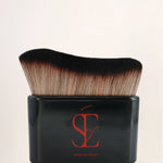 a photo of our body applicator brush for applying our attention seeker shimmer oil with no mess