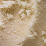 a close up texture shot of our vanilla scented body scrub for body acne, hyperpigmentation, dull skin, strawberry legs and clogged pores