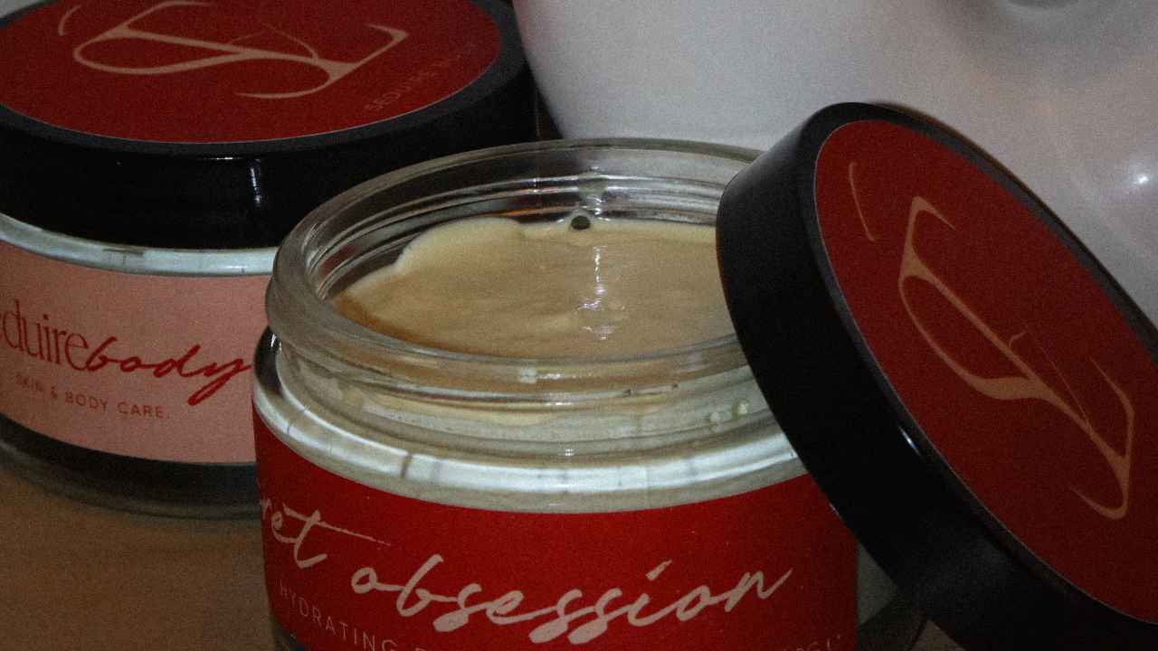 a photo of our hydrating secret obsession emulsified body butter body lotion for dry skin, eczema, and dull skin on a bathroom counter